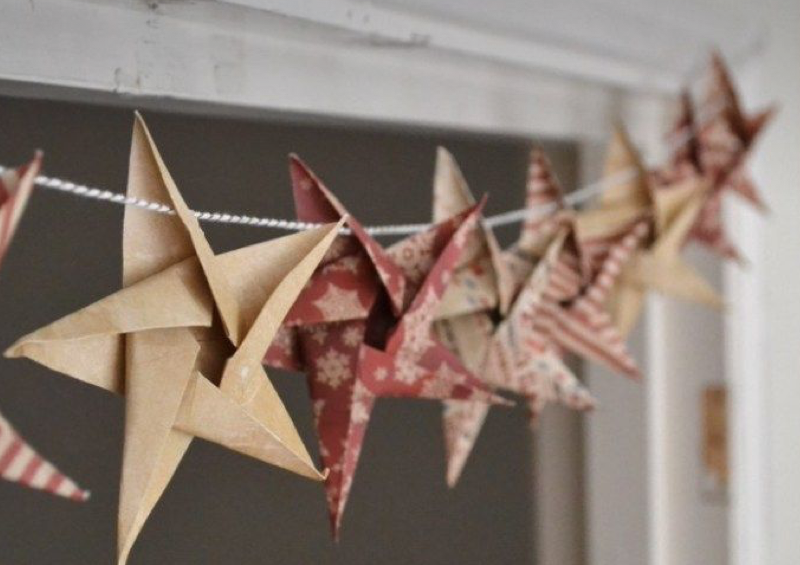 Eco friendly Christmas decoration trends including brown and red paper star garlands