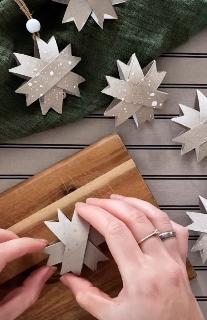 Eco friendly Christmas decoration trends including paper star gift tags