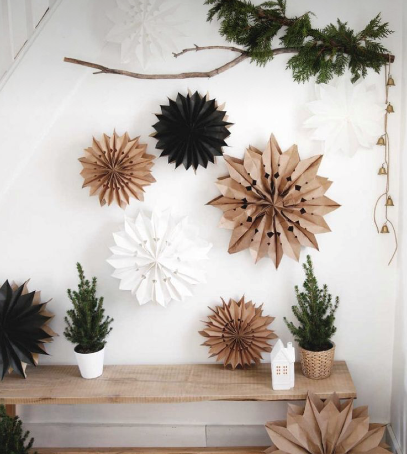 Eco friendly Christmas decoration trends include brown and white paper stars