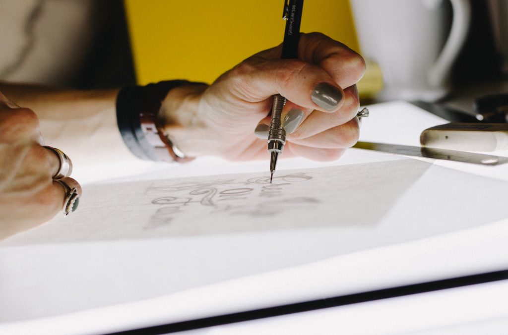 The interior design process - close up of person's hand with pen, designing